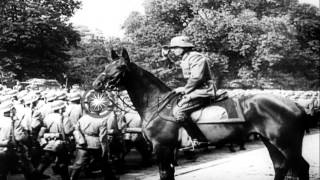 German troops decorated and troops pass in review along Avenue Foch Paris durinHD Stock Footage [upl. by Alleynad]