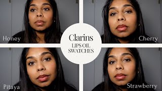 Clarins Lip Comfort Oil Swatches on Tan Skin  Honey Cherry Pitaya and Strawberry [upl. by Ticknor641]