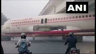 ViralVideo  Air India Plane Body Being Transported on Truck Gets Stuck Under Bridge in Bihar [upl. by Navarro390]