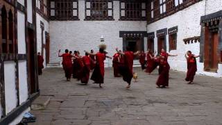 Dancing buddhist monks in Trongsa Dzong Bhutan [upl. by Gilead]