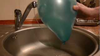 Electric force between the water and the balloon  physics experiment [upl. by Flossie42]