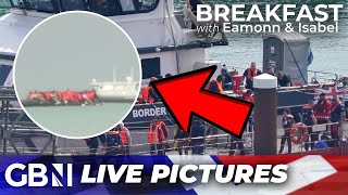 WATCH Dramatic footage shows DOZENS of migrants boarding dinghies to cross English Channel [upl. by Hosea850]