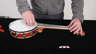 How to place the brige on Kmise banjo ukulele [upl. by Ayotan]