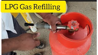 Very easy way to refills ⛽cocking gas  How to refill a cocking gas cylinder in a Moto gas station [upl. by Gefell]