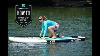 Standing up for the first time on a SUP  Getting into SUP how to video [upl. by Ahsineg]