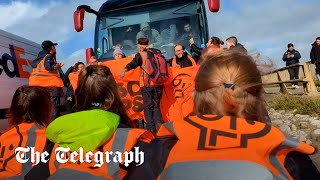 Driver ploughs through Just Stop Oil protesters blocking migrant coach heading to Bibby Stockholm [upl. by Jeffy]