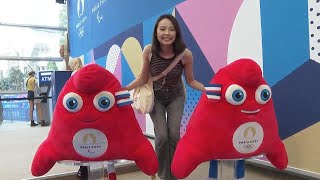 Demand for Olympic mascot souvenirs as throngs of tourists queue up at Paris 2024 merchandise store [upl. by Beghtol648]