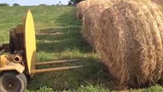 Homestead Animal Farm  Wrapping Large Round Hay Bales [upl. by Hilaria]