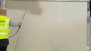 How to apply Thistle SprayFinish  Applying The Plaster  British Gypsum [upl. by Zelikow911]