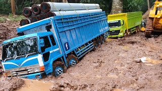 RC TRUK FUSO TRIBAL DAN RC TRUK HINO 500 BERMUATAN PAKU BUMI MELEWATI JALAN BERLUMPUR 🔥 miniatur [upl. by Ddot]