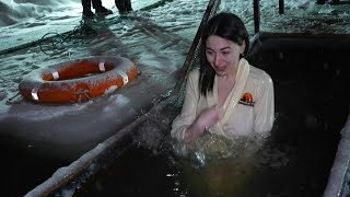 An ice cold dip for Russians marking Jesuss baptism on Epiphany  AFP [upl. by Ayrad]