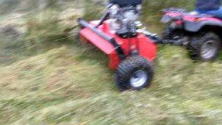 QUADX flail mower in action in WET RUSHES [upl. by Enobe]