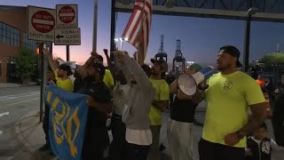 Dockworkers return to work after reaching tentative deal on wages [upl. by Reh933]