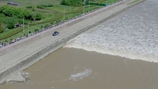 Aerial footage captures spectacular tidal bore on Qiantang River [upl. by Eiramesor499]