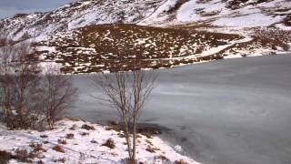 Winter View Frozen Loch Scottish Highlands Of Scotland [upl. by Nuhsal]