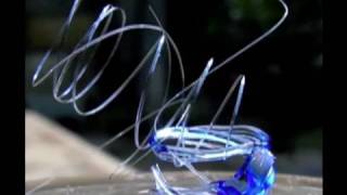 Melting Glass with the sun n Fresnel Lens to make glass springs with sun power [upl. by Jennee]