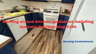 Working around kitchen appliances installing laminate flooring Vlog 194 [upl. by Assirrak]