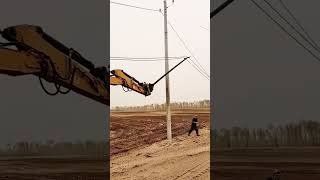 Wire laying process from ground onto a pole with an excavator [upl. by Wenz175]