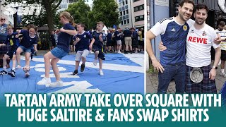 Tartan Army play football on huge Saltire and fans swap shirts in Cologne [upl. by Merkle862]