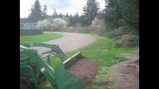 Operating a John Deere 2305 Tractor [upl. by Atinuj]