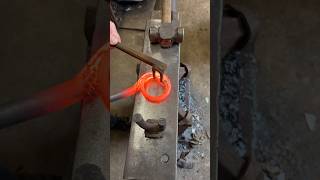 Blacksmith forges a loop curtain pole blacksmith makingvideos handmade shortswithcamilla [upl. by Eillak]