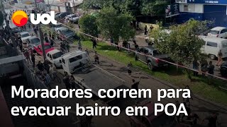 Enchentes no RS Moradores de bairro em Porto Alegre correm para sair de casa por risco em dique [upl. by Jed]