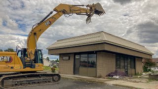 Caterpillar excavator crushes entire retail building [upl. by Atilegna]