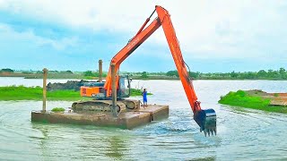 Excavator on pontoon crossing river TATA HITACHI EX215 Super long reach [upl. by Anirdnajela]