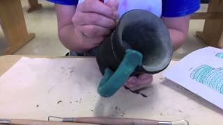 Underglazing a greenware mug and adding sgraffito designs [upl. by Jinny]