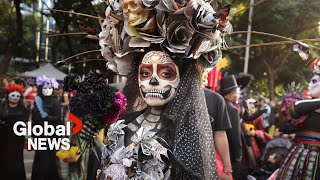 Day of the Dead celebrations quotLa Catrinaquot skeletons parade through Mexico City [upl. by Hamburger]