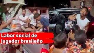 El futbolista Matheus Cunha repartió comida en una favela de Brasil  El Espectador [upl. by Ahsiem537]