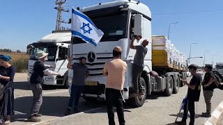 Protesters attempt to block humanitarian aid passing into Israels Kerem Shalom crossing [upl. by Adaval631]